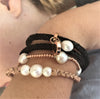 Leather and pearl combo of bracelets